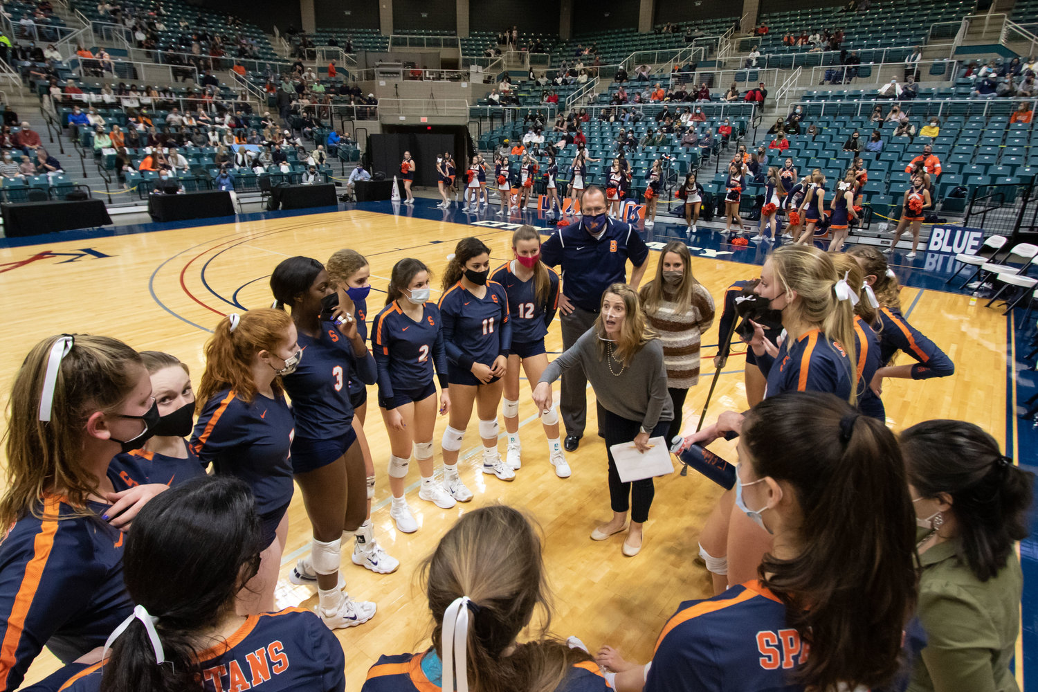 Seven Lakes volleyball coach Amy Cataline talks with her team during their Class 6A state semifinal match against San Antonio Reagan on Dec. 7, 2020 at the Merrell Center. The team went on to take home the state championship after a lot of hard work and determination that players say was inspired by Cataline.